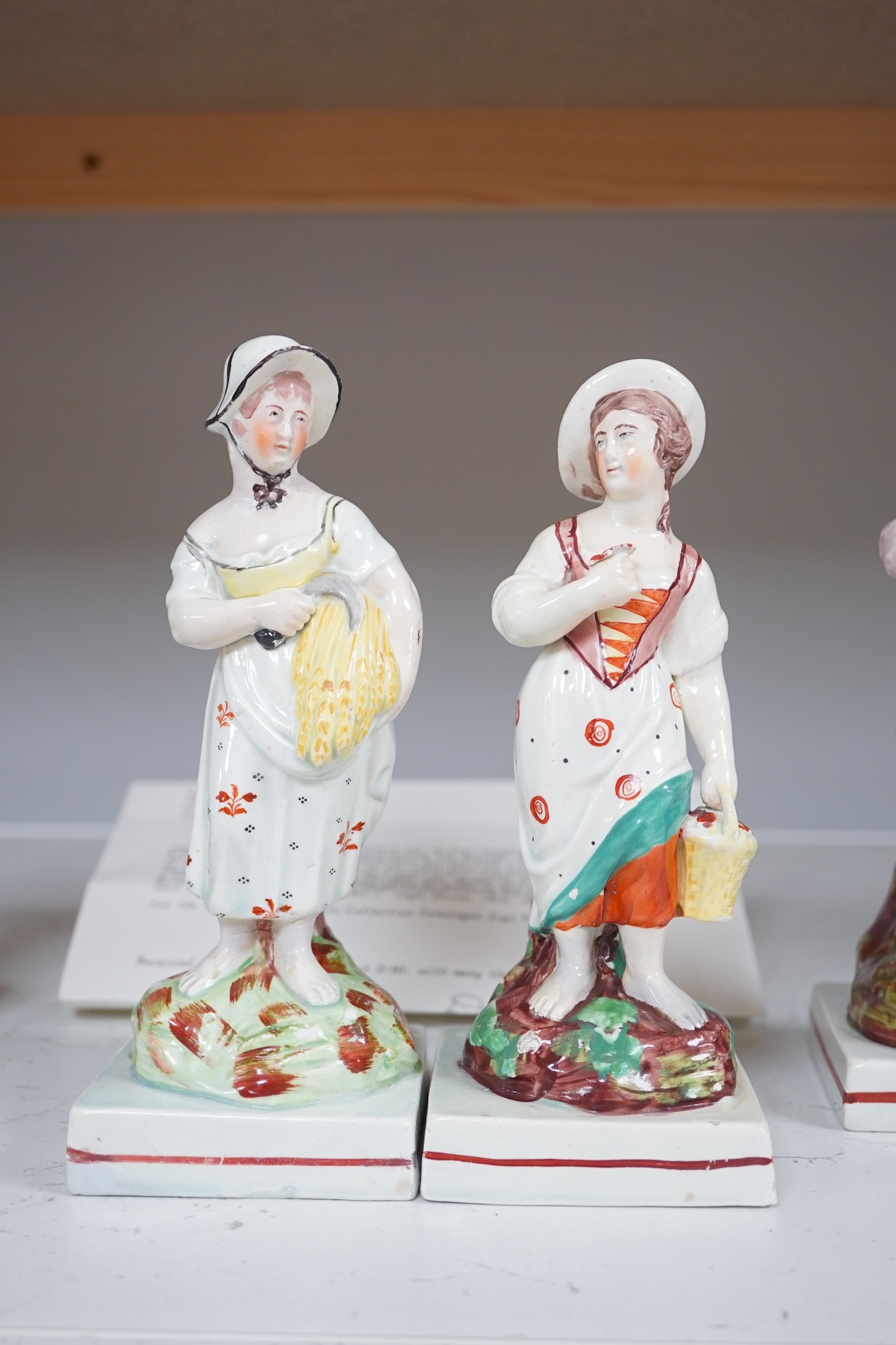 Four Enoch Wood pearlware models of the Seasons, c.1810, tallest 19.5cm. Condition - base of Autumn restored at the back otherwise fair to good